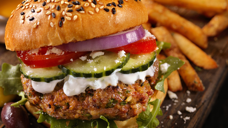 lamb burger served with cucumbers and sauce