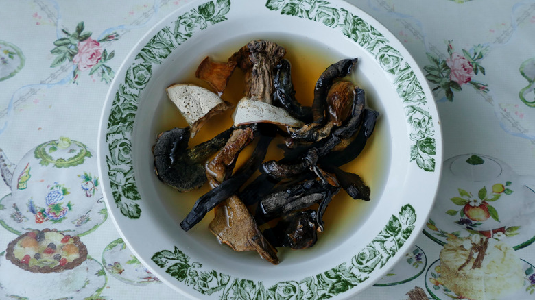 dried mushrooms rehydrating in bowl