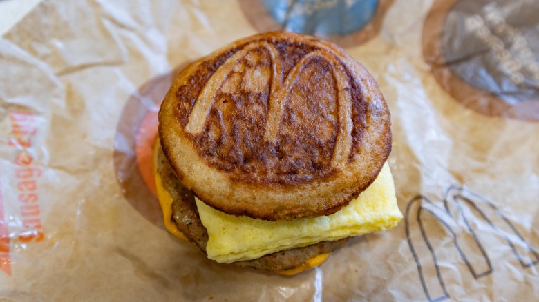 A sausage McGriddle breakfast sandwich on a wrapper