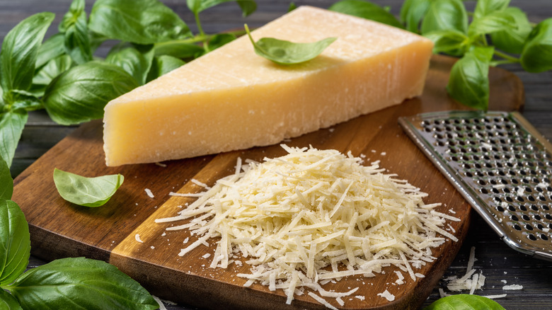 Grated Parmesan on cutting board