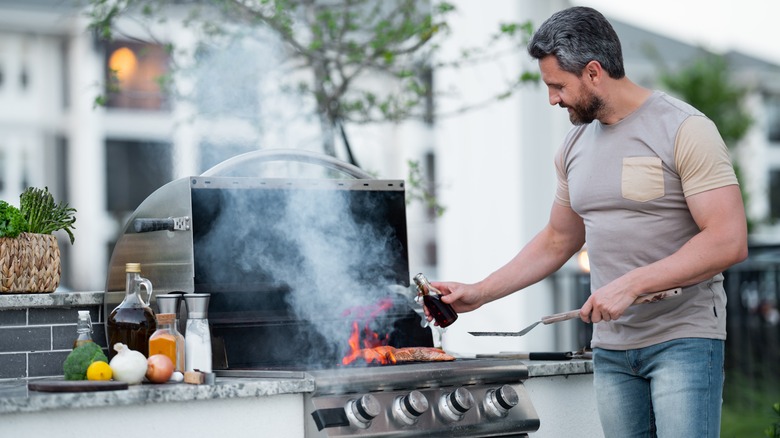 Person grilling fish