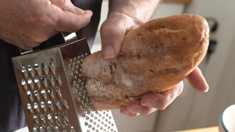 home chef grating bread loaf