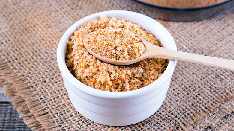 spoon scooping bread crumbs