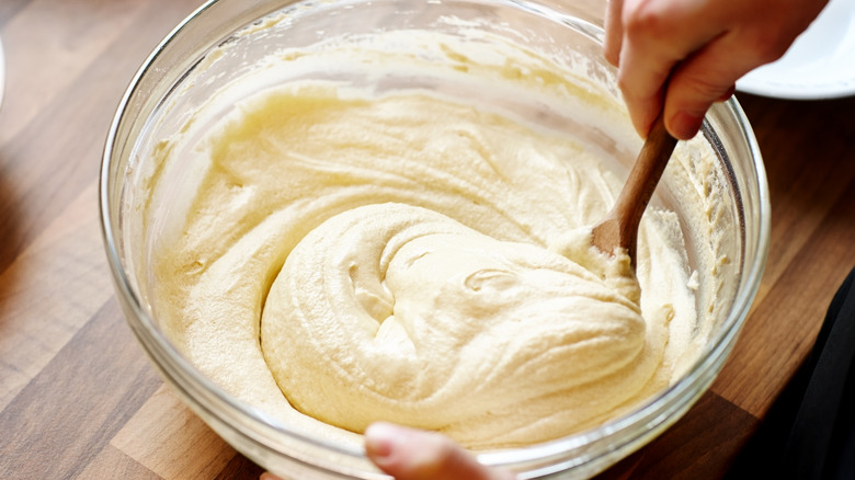 stirring cake batter in bowl