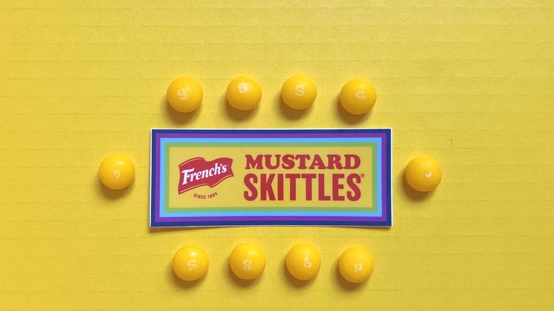 Mustard Skittles around a sticker