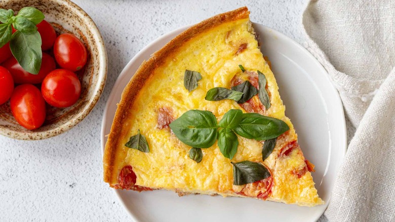 slice of tomato, prosciutto, and basil frittata