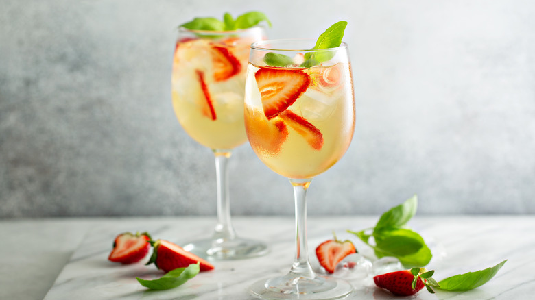 Sangria with herbs in glasses