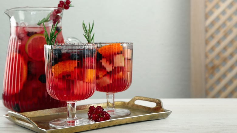 Red sangria with sprigs of rosemary