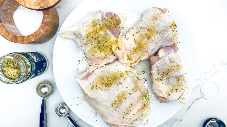 seasoned chicken thighs on plate