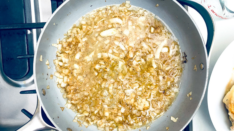 onions in wine in pan