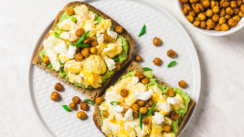 Crispy chickpeas and scrambled eggs on avocado toast