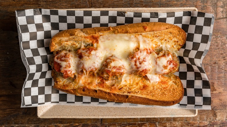 Meatball sub on checkered napkin