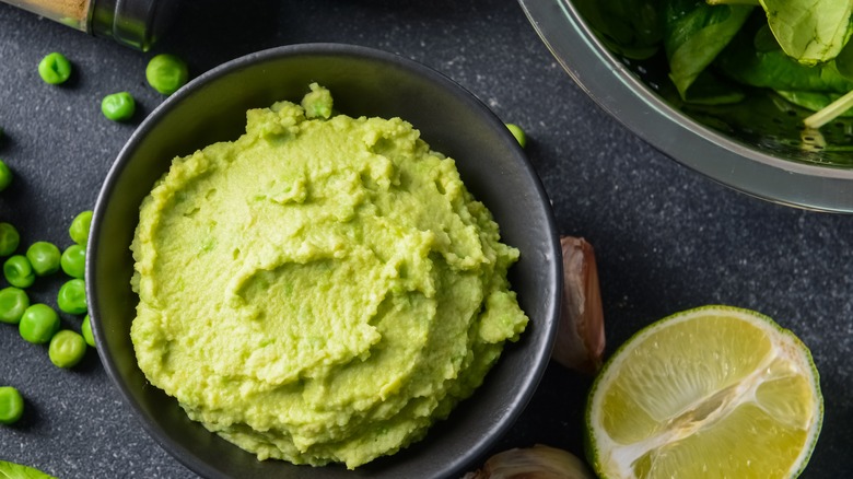 bowl green hummus spinach peas lime