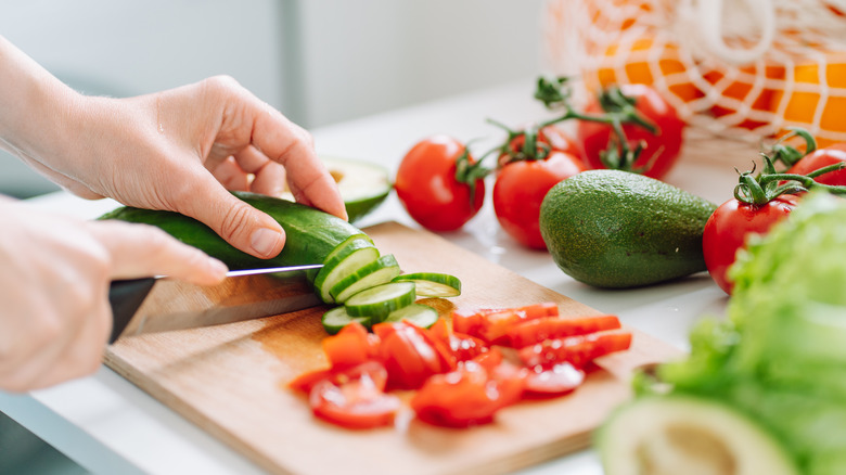 person chopping vegetables