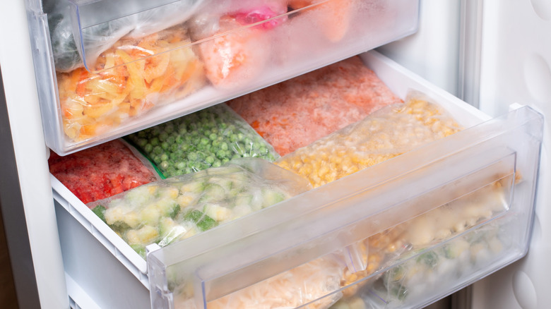 Bags of frozen vegetables in the freezer