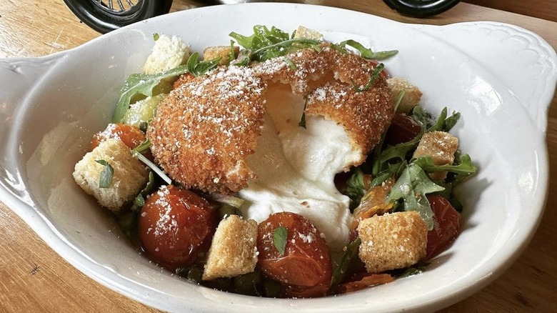 Fried burrata over salad