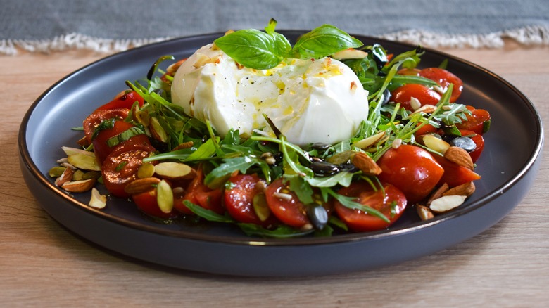 Burrata over tomato salad