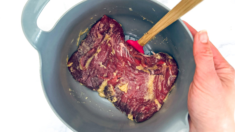 steak coated with garlic marinade