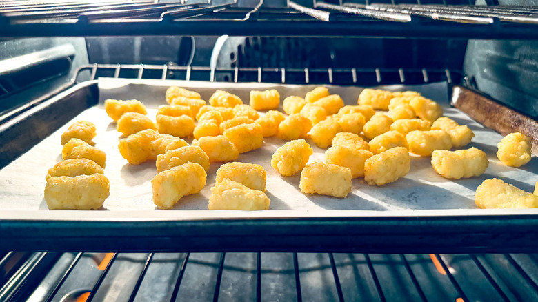 tater tots baking in oven