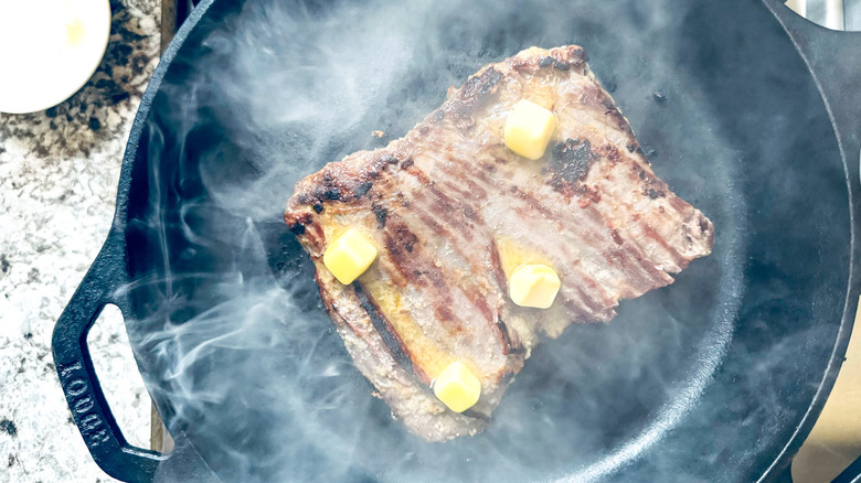 seared steak cooking with butter