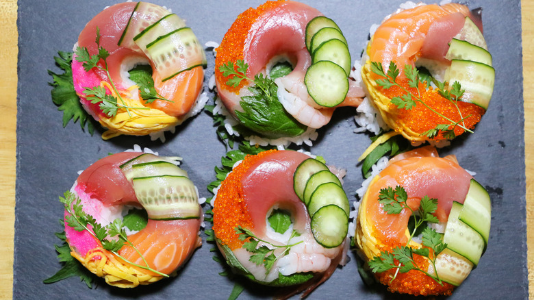 sushi donuts on black tray