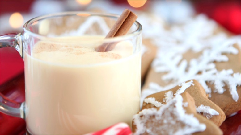 Mug of eggnog with cinnamon stick 