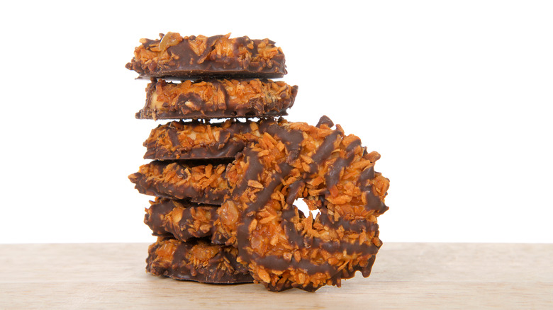 girl scout cookie samoas stacked on top of each other