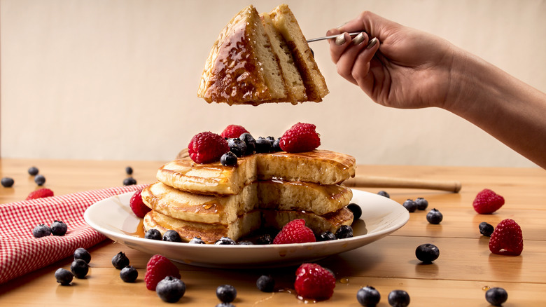 Pancakes with berries and syrup