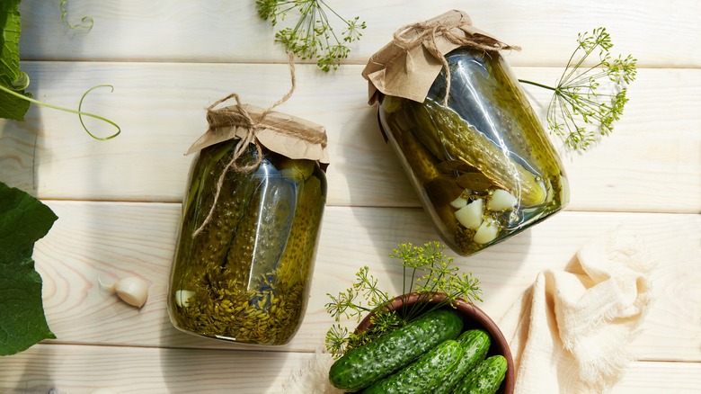 Pickles in jars of brine