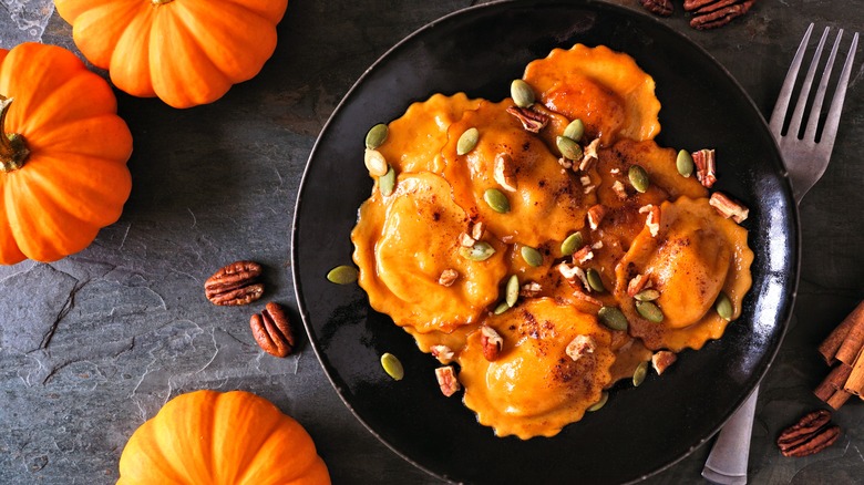 pumpkin ravioli on black plate