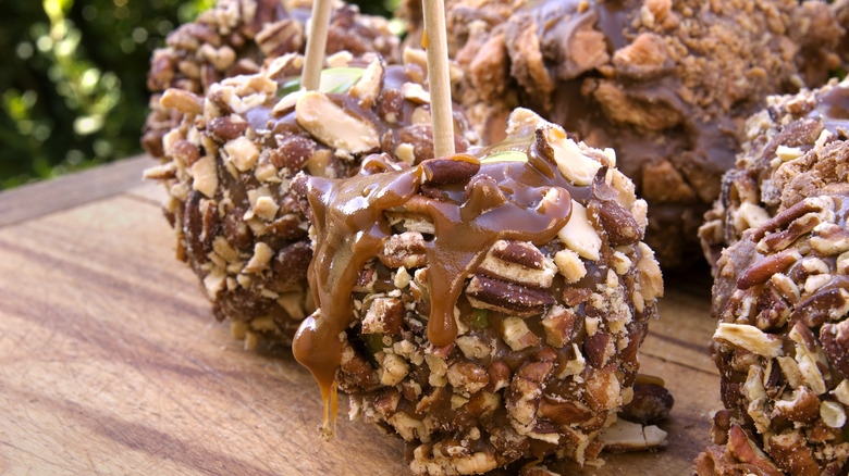 Caramel apples coated with nuts