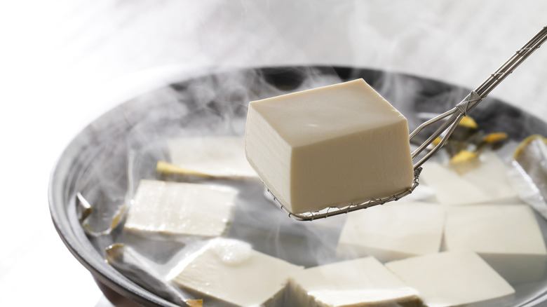 boiling cubed tofu in hot water