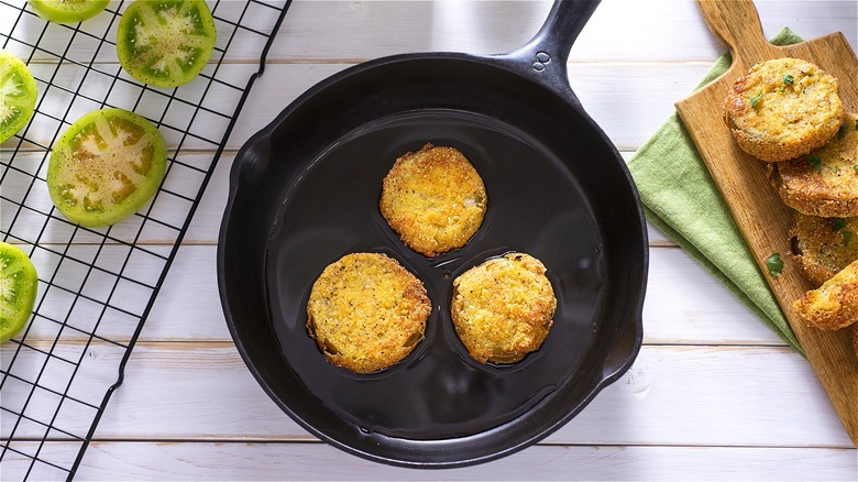 Fried green tomatoes in iron skillet 