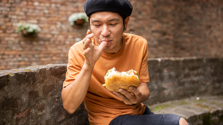 Person eating a burger