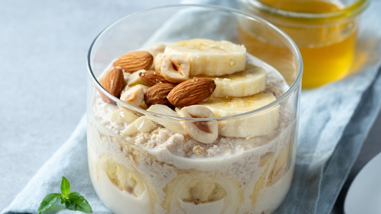 Jar of overnight oats with banana and nuts