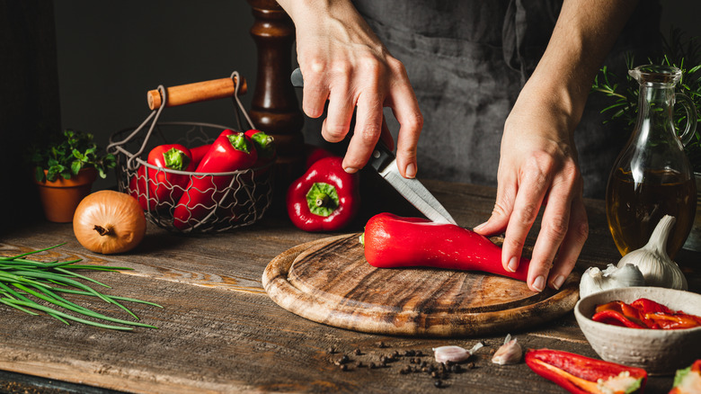 Chef chopping peppers