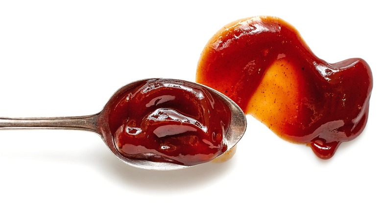 Barbecue sauce on silver spoon 