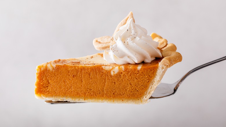 Pumpkin cheesecake slice on fork