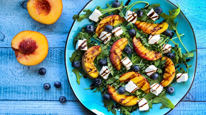 Colorful salad drizzled with vinaigrette