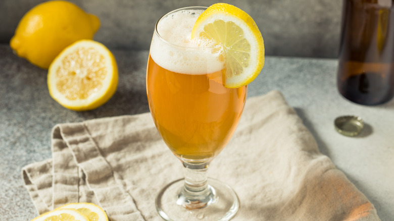 Shandy in glass with lemon