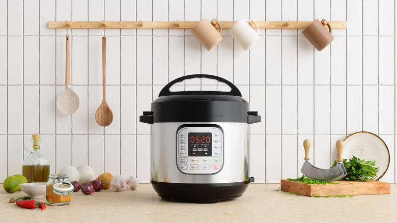 Slow cooker on counter with ingredients