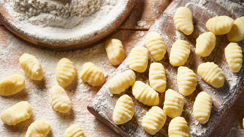 potato gnocchi floured on wood board