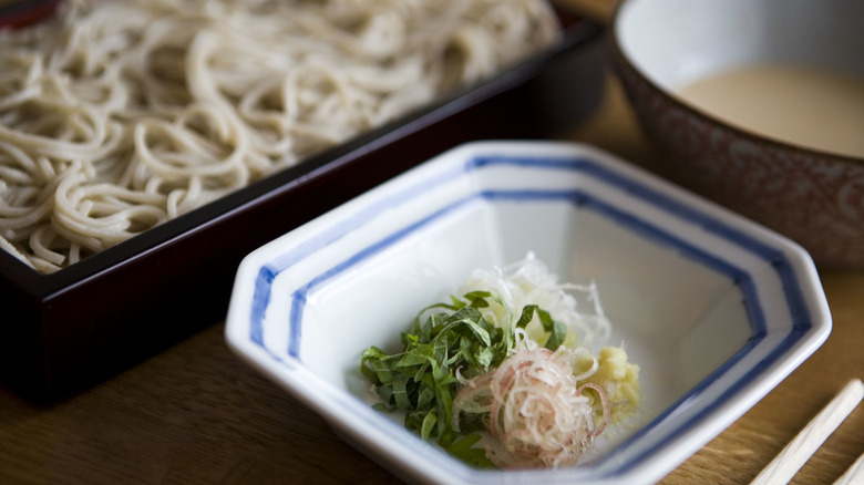 Soba noodles and garnishes with goma-dare