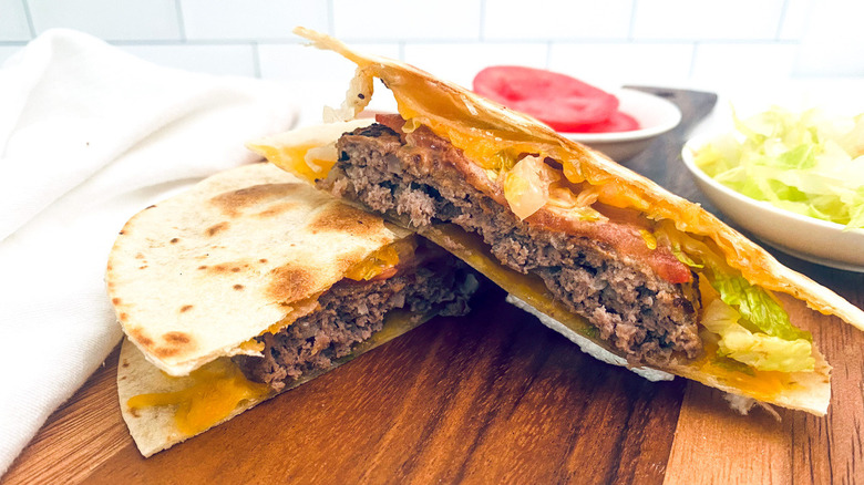 quesadilla burger on wooden board