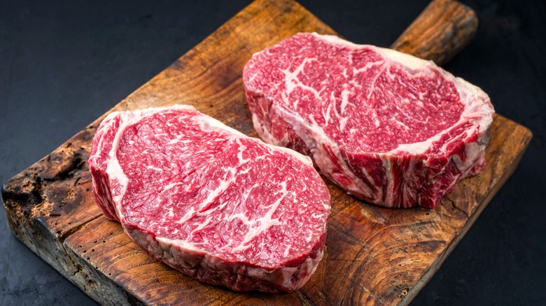 Wagyu steaks on a wooden board