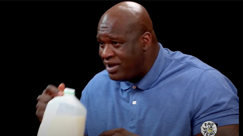 Shaquille O'Neal holding milk gallon