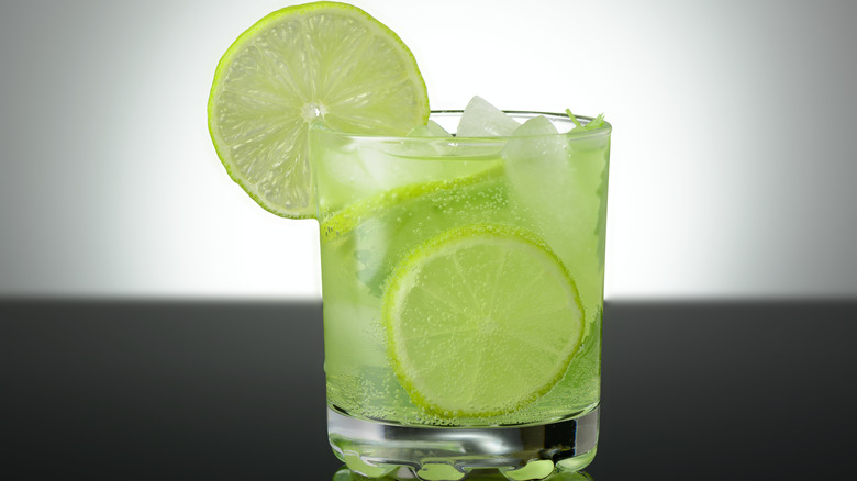 green cocktail with lime