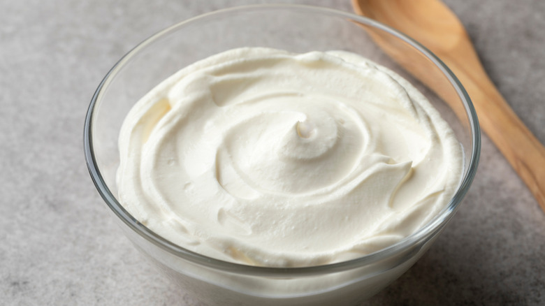 bowl of creme fraiche, wooden spoon