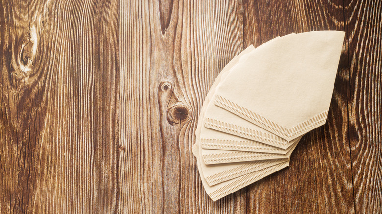 Coffee filters against wood background