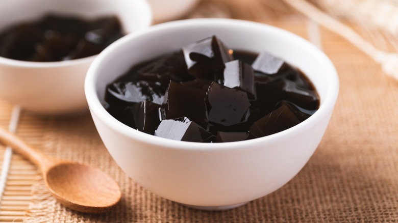 two bowls of grass jelly cubes